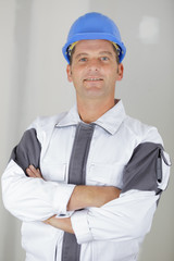 portrait of mature workman with arms crossed