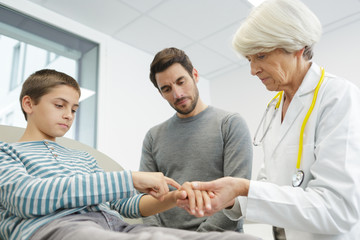 female doctor sitting with boy