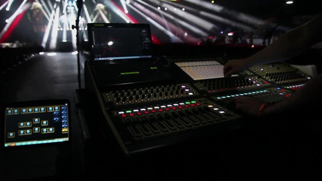 remote recordists closeup. Hand adjusts sound effects. Electric machine on table for working of sound designer or club dj at party in nightclub. Occupation for modern lifestyle, objects for listen at 