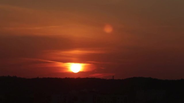 Sunset Timelapse with plane chemtrails over the city of Gdansk