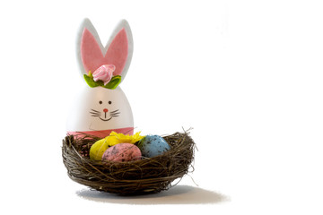 Easter scene with colored eggs, easter bunny,, white background