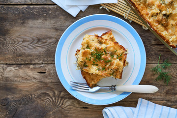 Cauliflower casserole with cheese and fresh herbs 