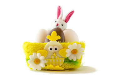 Chocolate eggs in bird nest , Easter holiday decorations , Easter concept background. Eggs hunt.