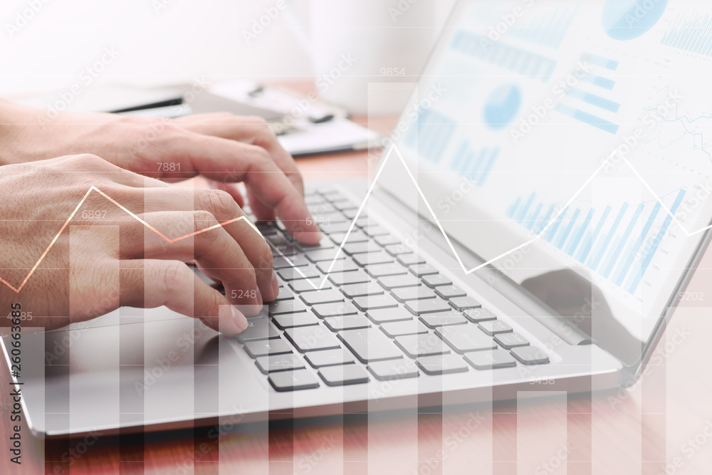 Fototapete Analyzing statistical data. Using laptop for calculation.Businessman preparing reports. Many graphs and charts.