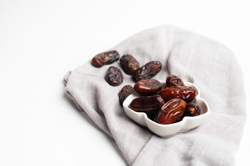 Ramadan Kareem Festive, close up of dates at the bowl on white isolated background