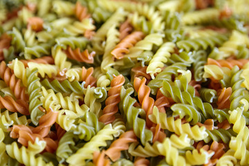 Pasta fusilli tricolore background