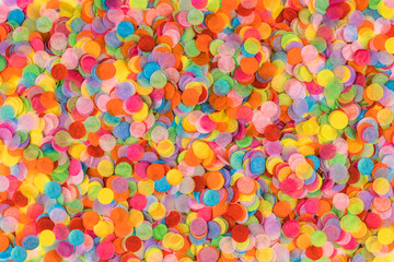 Fototapeta na wymiar Festive multicolored confetti background. Flat lay style.