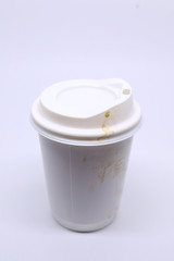 dirty brown stain on take away cup for hot coffee drink, paper mug on white background