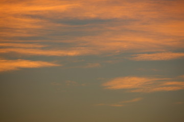 Fototapeta na wymiar orange sunlight shiny through cloud on dramatic dusk sky