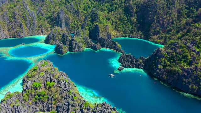 Aerial view Tropical lagoon with azure water with sailing boats near Kayangan and Barracuda Lake. Coron, Busuanga Philippines.