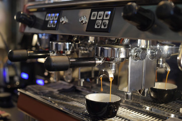 close up of coffee machine preparing cup of coffee