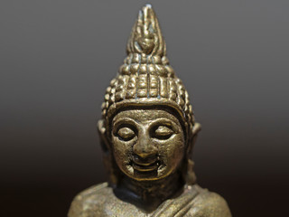 Fototapeta premium Indoor close-up photography of a bronce buddha statue.