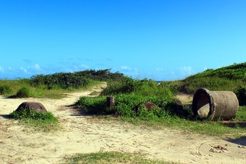 Landscape of the entrance with rough obstacles of the Barra do Una beach, located in...