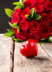 . Nature and beautiful red roses bouquet on abstract background. St. Valentine's Day