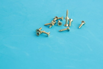 golden star screws, in colorful background