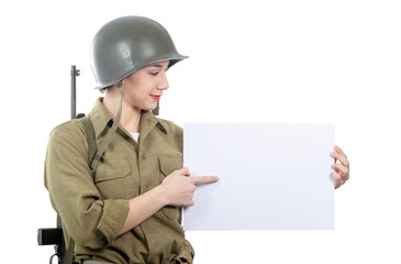 young woman dressed in American ww2 military uniform showing empty blank signboard