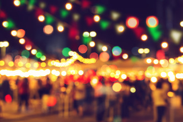 blur bokeh night festival warm light cool chill party in walking street.