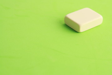 white eraser on color background
