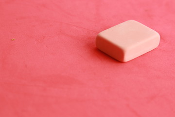 pink eraser on colorful background