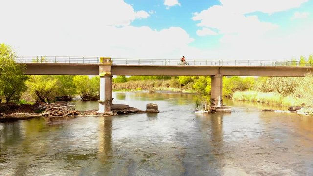 Bikers over the brige over the Segre river