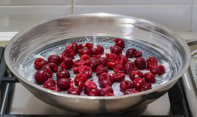 cherries in a skillet, ingredients for a pie