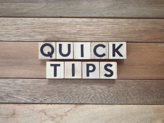 Motivational and inspirational words - Quick tips written on wooden blocks.