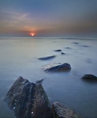 Amazing seascape during sunset with slow shutter.