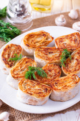 Fried lavash rolls with potatoes and mushrooms