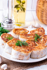 Fried lavash rolls with potatoes and mushrooms
