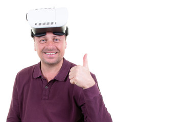 man playing in virtual reality goggles happy smile thumbs up in white background with copy space
