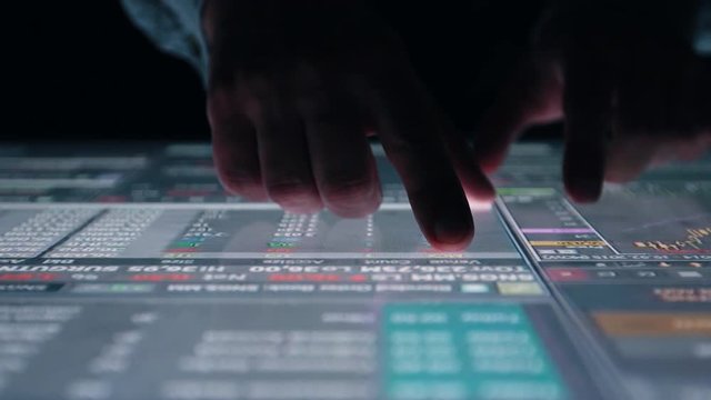 Man indicators on sensor touch screen sensory interactive table in the dark. 