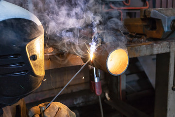 Welder brews a control sample from small diameter pipes to confirm his qualification