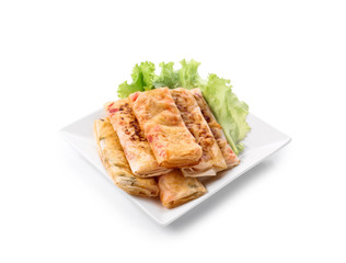 Plate with tasty fried spring rolls on white background