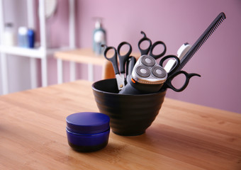 Set of male shaving accessories with cream on wooden table