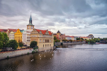 Scenic spring view of the Old Town pier architecture and Charles Bridge over Vltava river in Prague, Czech Republic .