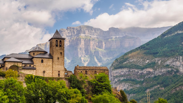 Torla Ordesa, church with the mountains at bottom, Pyrinees Spain