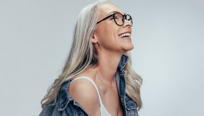 Cheerful senior woman looking at copy space