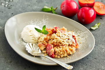 Plum crumble with almond crumb and ice cream.