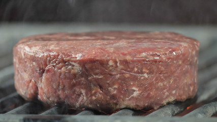 Big beef cutlet is grilled, close-up side shot