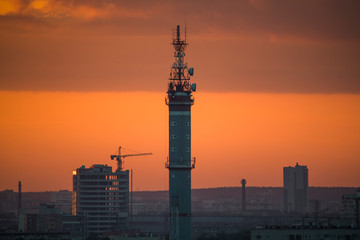Ekaterinburg, Russia - Jule, 2018: Telephoto lens shot of cityscape view megalopolis during sunset at summer evening