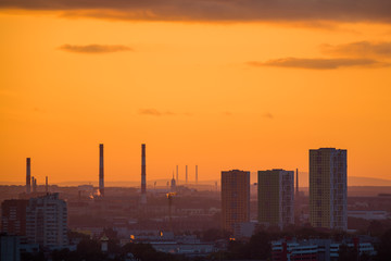 Ekaterinburg, Russia - Jule, 2018: Telephoto lens panoramic shot of cityscape view megalopolis during sunset with at summer evening