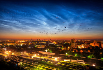 Fototapeta na wymiar Noctilucent clouds over Yekaterinburg city downtown at summer night