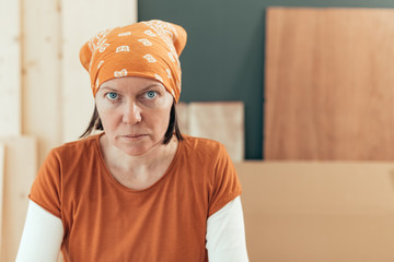 Self employed female carpenter looking at camera portrait