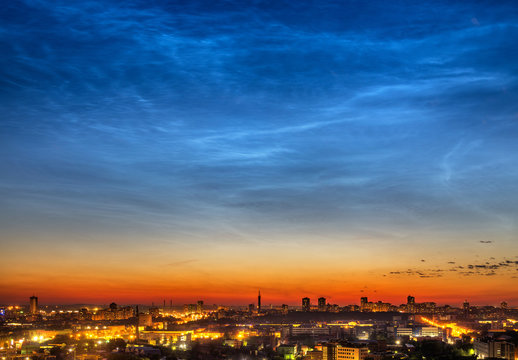 Noctilucent clouds over Yekaterinburg city downtown at summer night