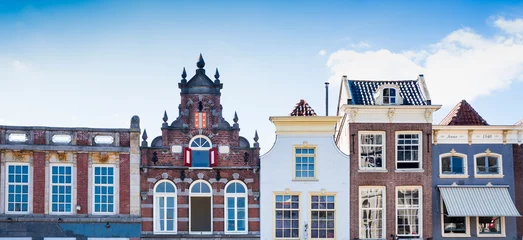 Fotobehang stepped gable houses on market square in Goud, The Netherlands. Banner © Corinne