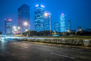 traffic light trails and modern street.
