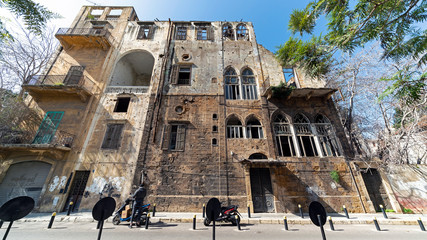 The scars of Lebanese Civil War are still visible in the ruined mansions of Central Beirut - obrazy, fototapety, plakaty