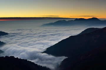 sunset over  sea of clouds