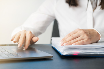 Fototapeta premium Woman working at office hand on keyboard close up