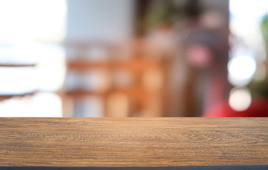 Empty dark wooden table in front of abstract blurred bokeh background of restaurant . can be used for display or montage your products.Mock up for space.